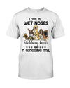 Love is wet noses slonnery kisses and a wagging tail